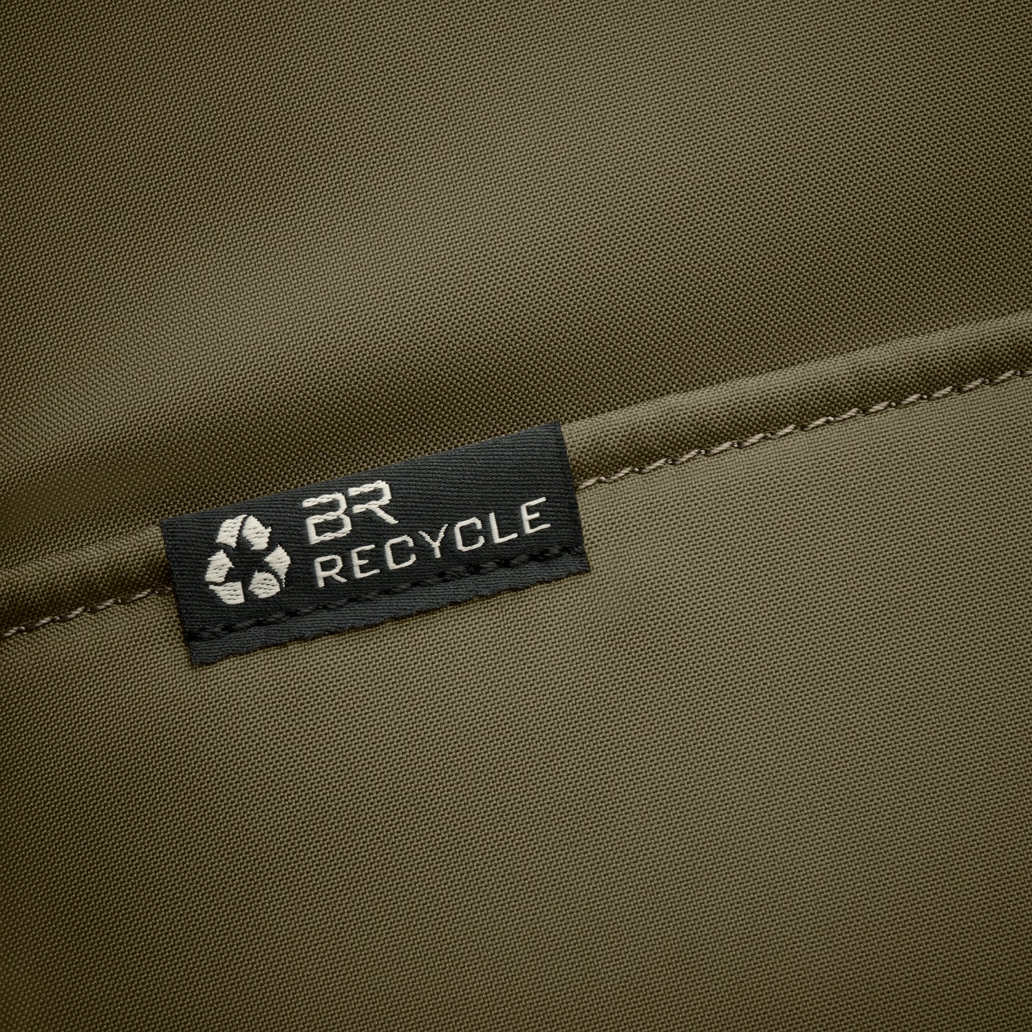 Briggs & Riley Slim Expandable Backpack Black Recycled Logo Close-up #color_black