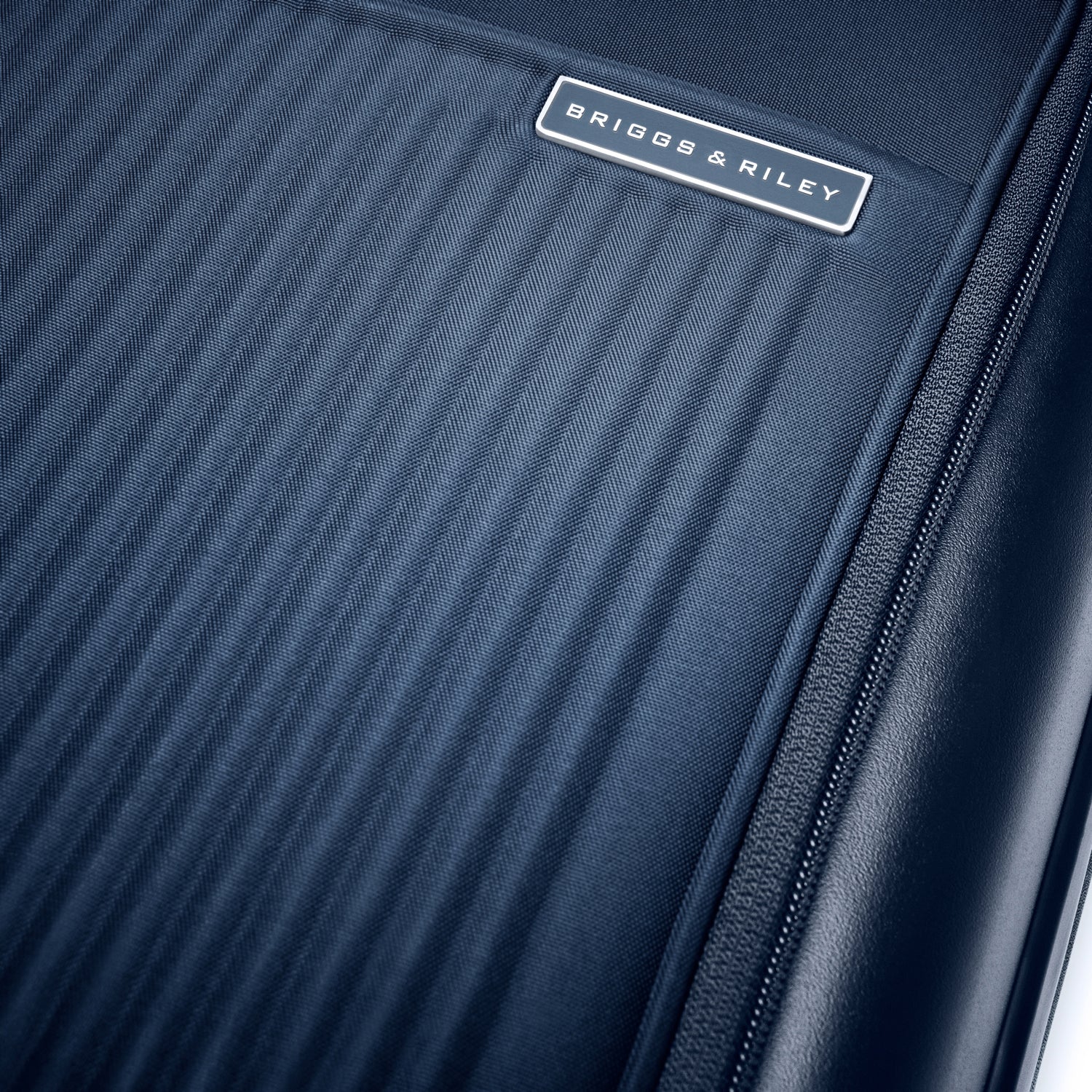 Essential Front Pocket Carry-On Expandable Spinner in Navy, Front View #color_navy