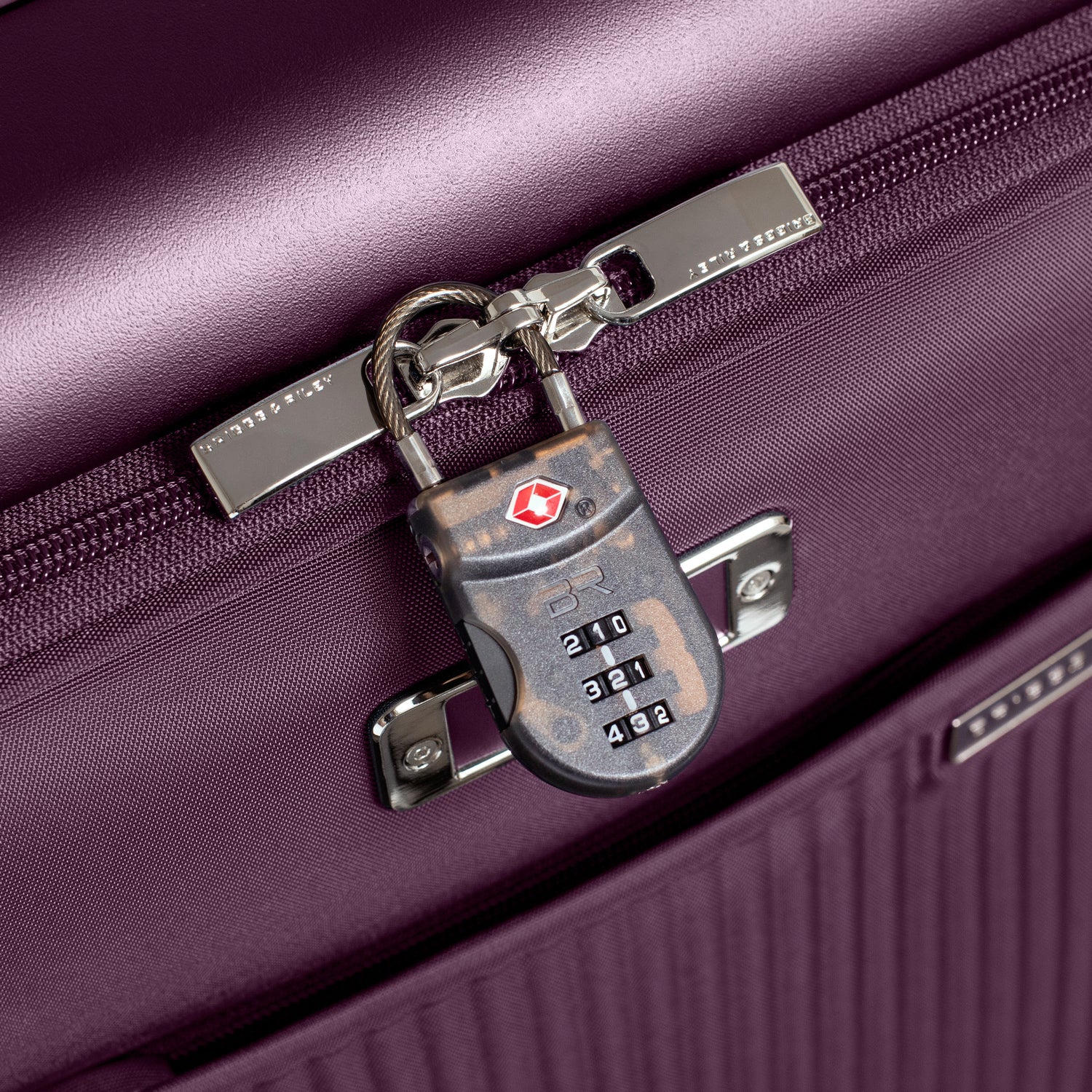 Essential Front Pocket Carry-On Expandable Spinner in Plum #color_plum