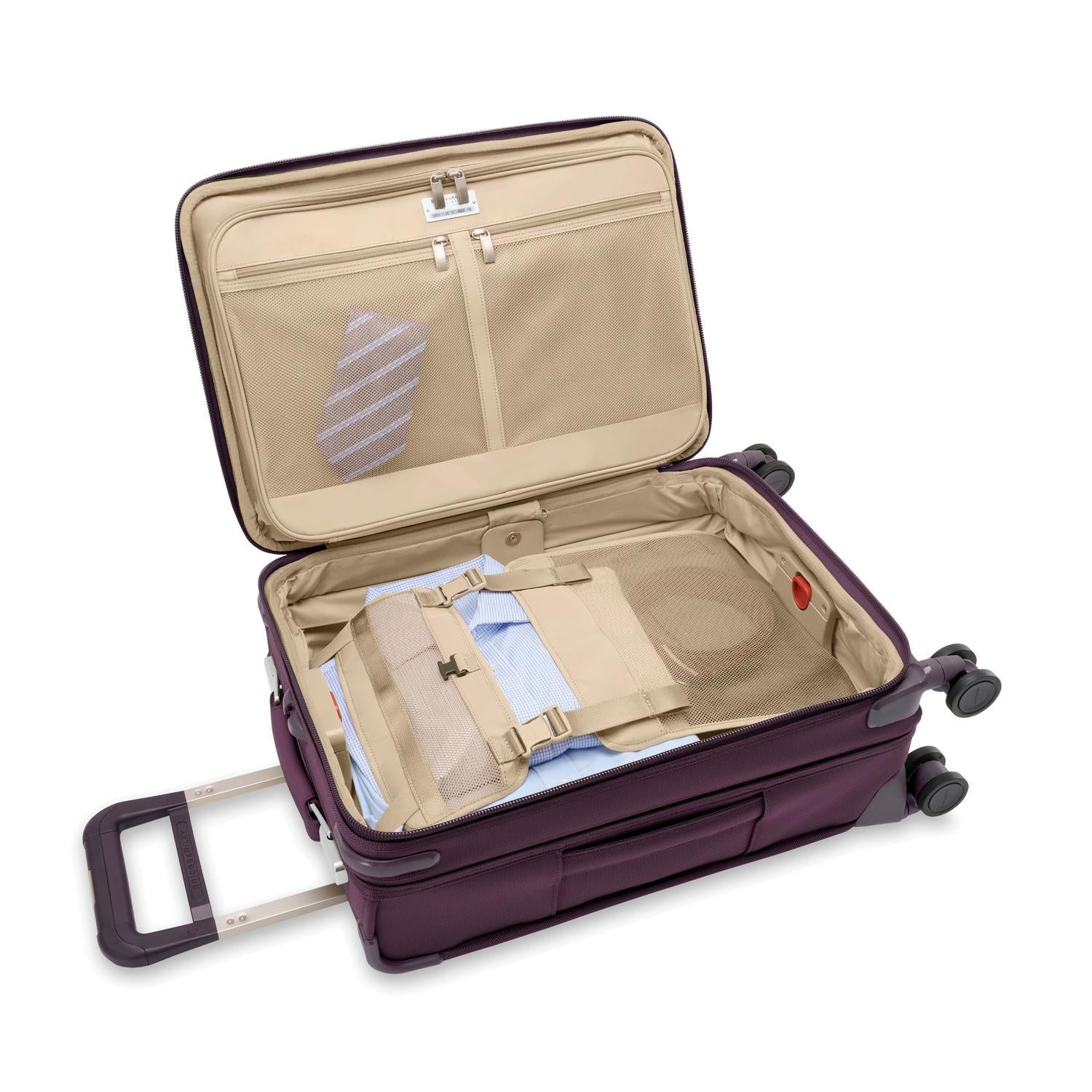 Baseline Essential 22" Carry-On Expandable Spinner Plum Open Packed #color_plum