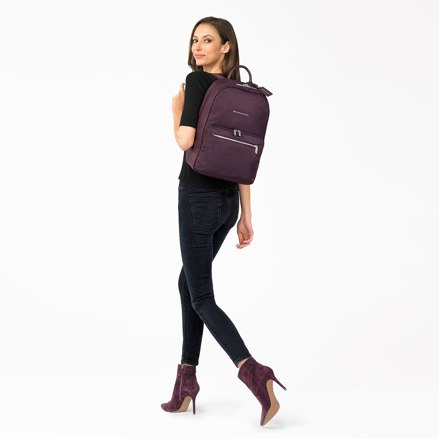 model wearing Essential Backpack #color_plum